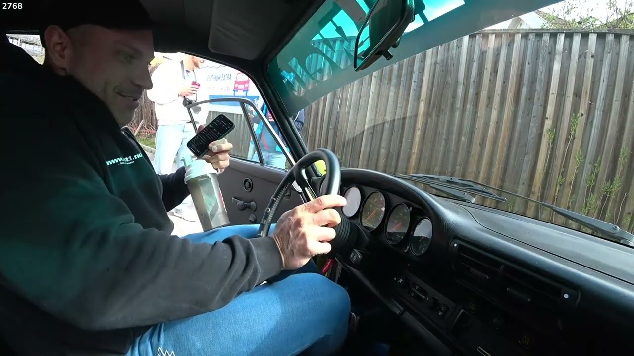 Big man Knut try's to get in a small car