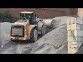 Cat 980K wheel loader stockpiling stone