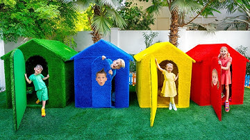 Cinq enfants jouent à cache cache dans des maisons colorées