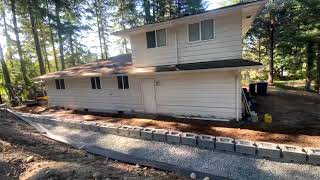 Building a “Cornerstone” block retaining wall part #2. 105’ long wall build in 6 min! #diy