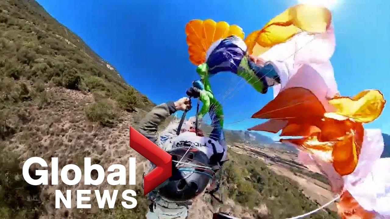 Close call Paraglider's parachute gets tangled in midair YouTube