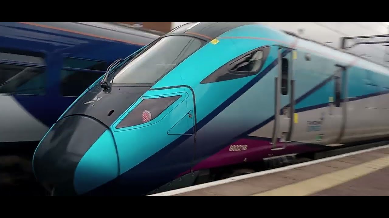 Transpennine Express 802 departs Manchester Airport 