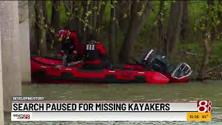Search paused for missing kayakers