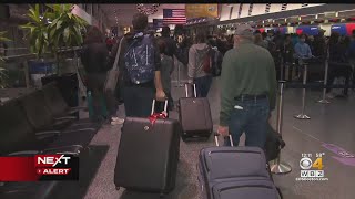 Dreary weather continues at Logan Airport but lines lighten up