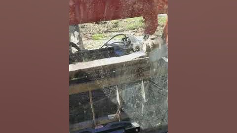 Tree removal with grapple on skid steer