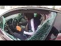 Officer Clings to Moving Car Before Firing Shots at Fleeing Suspect