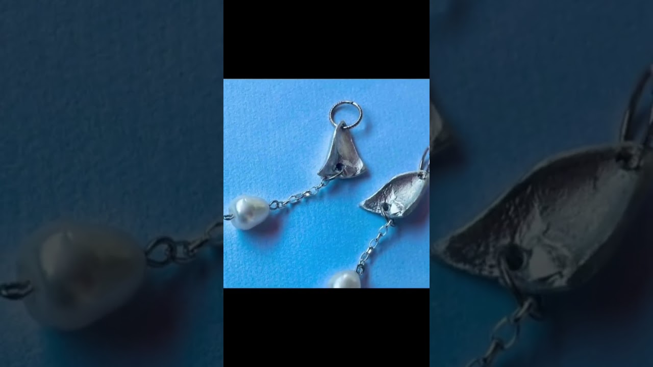 Holographic silver flake ring design.