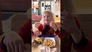 Emerald eats a burger