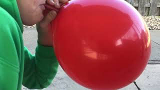 Blowing up a balloon until it pops