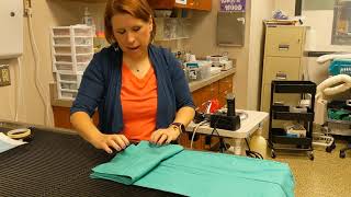 Folding and Packing Fenestrated Drape