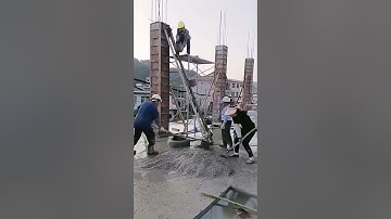 The process of manually pouring concrete into the column formwork
