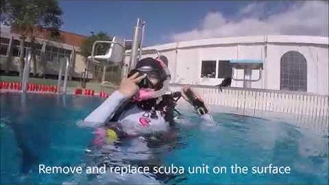 PADI Divemaster / PADI Instructor Skills   - Remove and replace scuba on surface