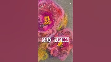Making textile art with beautiful silk fiber fusion and bits of fabric and wool.