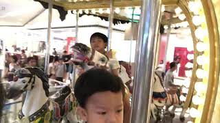Matteo Zachary carousel ride with Bettina