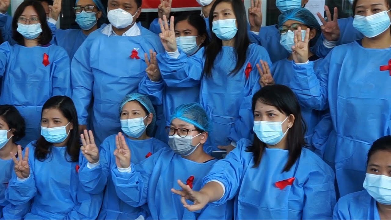 Myanmar medics wear red ribbons in coup protest | AFP - YouTube