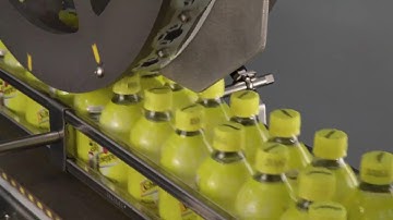 Continuous Motion Handle Applicator - Speeds up to 600 bottles per minute with splicing