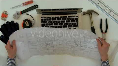 Engineer Explaining Technical Drawing During Video Call on Laptop | Stock Footage - Videohive