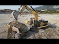 Caterpillar 374D Excavator Loading Caterpillar 730 And 740 Articulated Dump Trucks - Interkat SA
