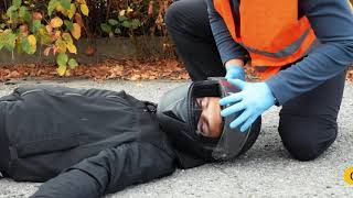 Traffic accident, removal of motorbike helmet