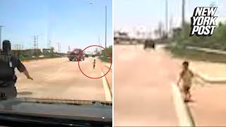 Toddler rescued by cop after nearly getting run over