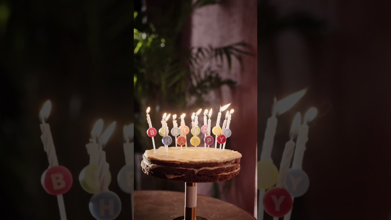 Blowing The Candles of A Birthday Cake