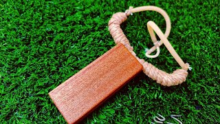 Creative children's slingshot with an attractive arrow (combination of wood, metal and rope)