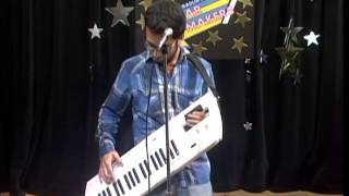 Skatterplot plays the keytar and sings a song.