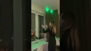 Excited Lady Clapping to Activate the Lights and Change Colors