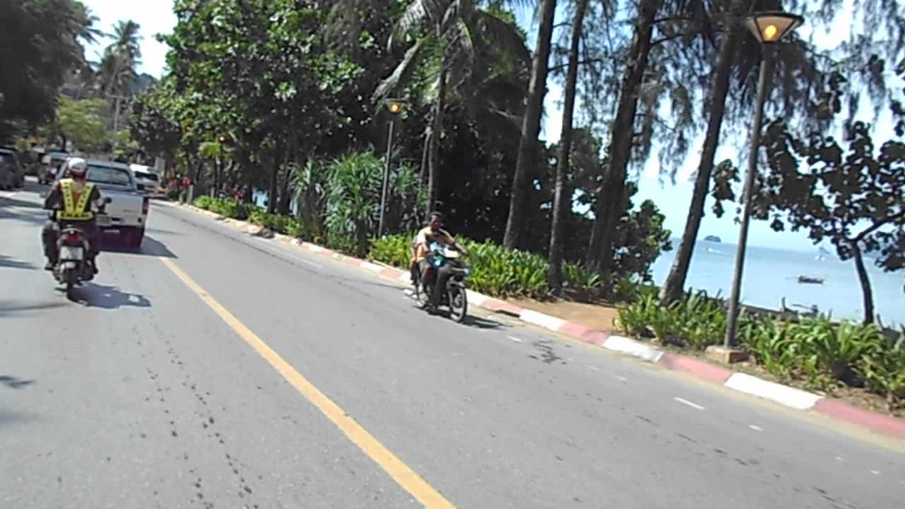 Songkran, Thai New Year, 2012. Ao Nang, Krabi, Thailand. 10AM on a motor scooter