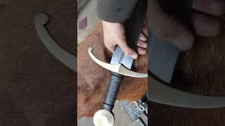 Forging a arming sword.