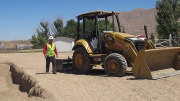 Cat Skip Loader Grader Work by Operator Baker