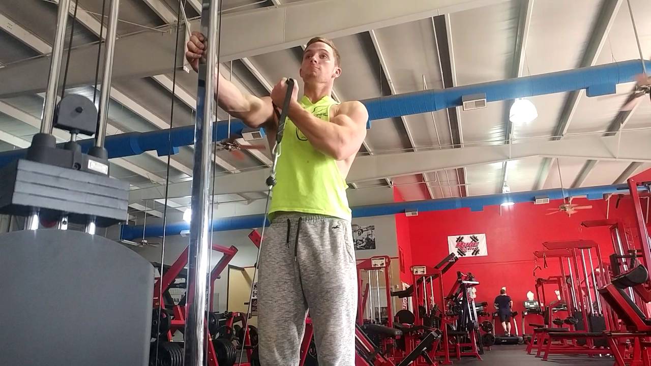 Teen bodybuilder training arms