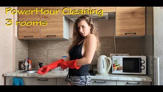 PowerHour Cleaning 3 rooms in black top and shirt