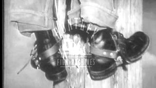 Lineman Climbing Pole.  Archive film 94365