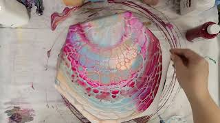 Delicate, lacy open cup pour on a hexagon canvas