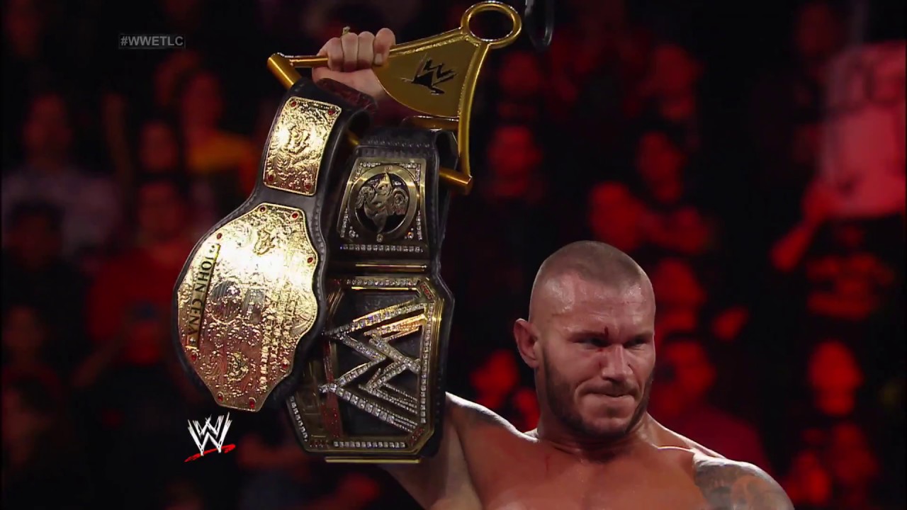 Randy Orton with both the World Heavyweight Championship and WWE Championship titles.