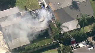 Plane crashes into California house, sparking fire