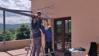 Lifting another beam into place