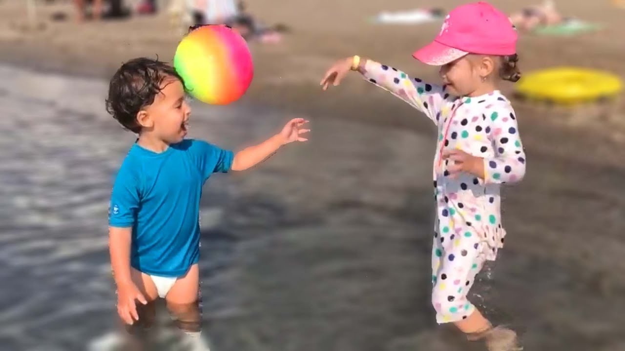 Baby Alp is playing ball with friend in the swimming pool and crying