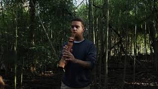 Playing a Drone Flute in a Bamboo Grove