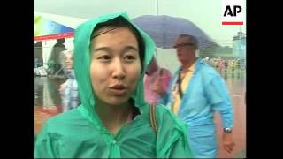 Heavy rain, fans after US beats China in beach volleyball final