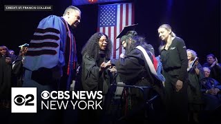 St. Francis College student with cerebral palsy walks across graduation stage