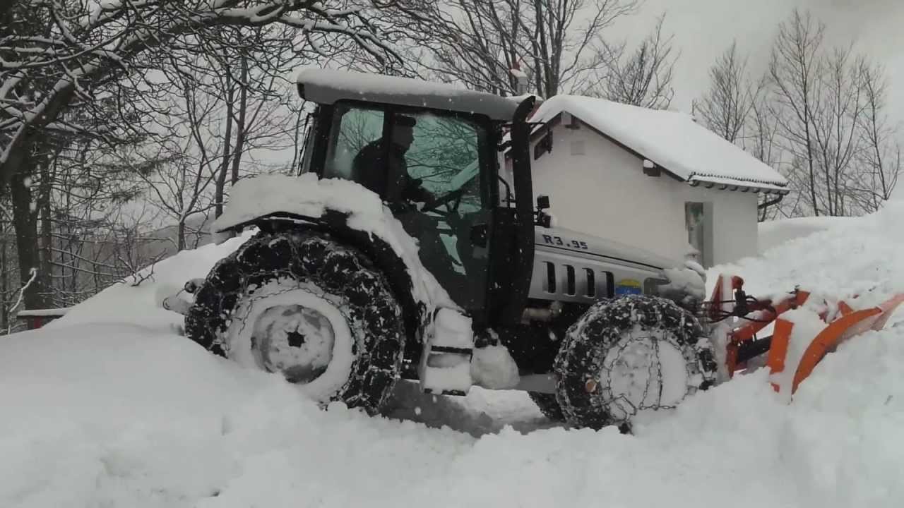 tractor plowing snow and stuck in it YouTube