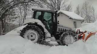 Lamborghini tractor plowing snow and stuck in it