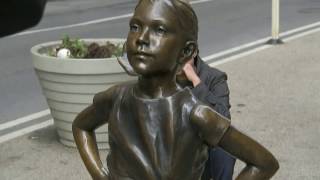 Fearless girl at WALL Street faces the global Financial Bull | International Women's Day
