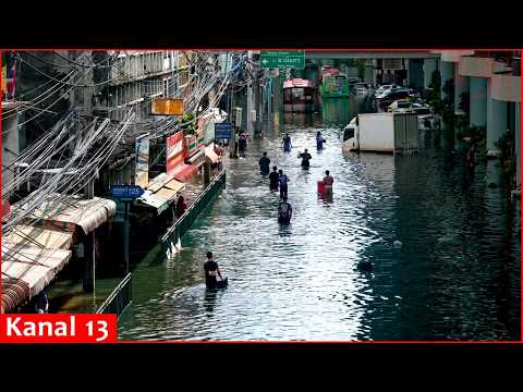 People navigate Bangkok’s flooded streets after days of heavy rain