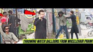 Throwing Water Balloons From Wheelchair Prank @SillyPrankTV