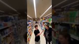 Guy gets chased by tall creature in store