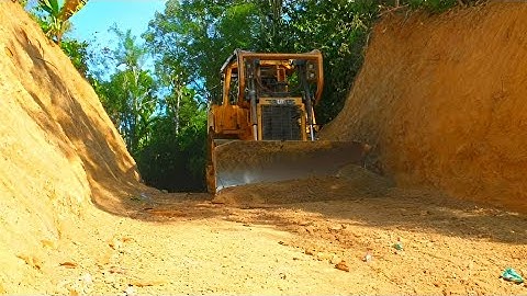CAT D6R XL Bulldozer Leveling Land for Roads in Plantations