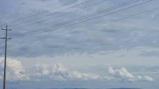12:59pm April 9, 2026 - Convection Over Hills, Altocumulus Clouds Partly Cloudy & South Winds